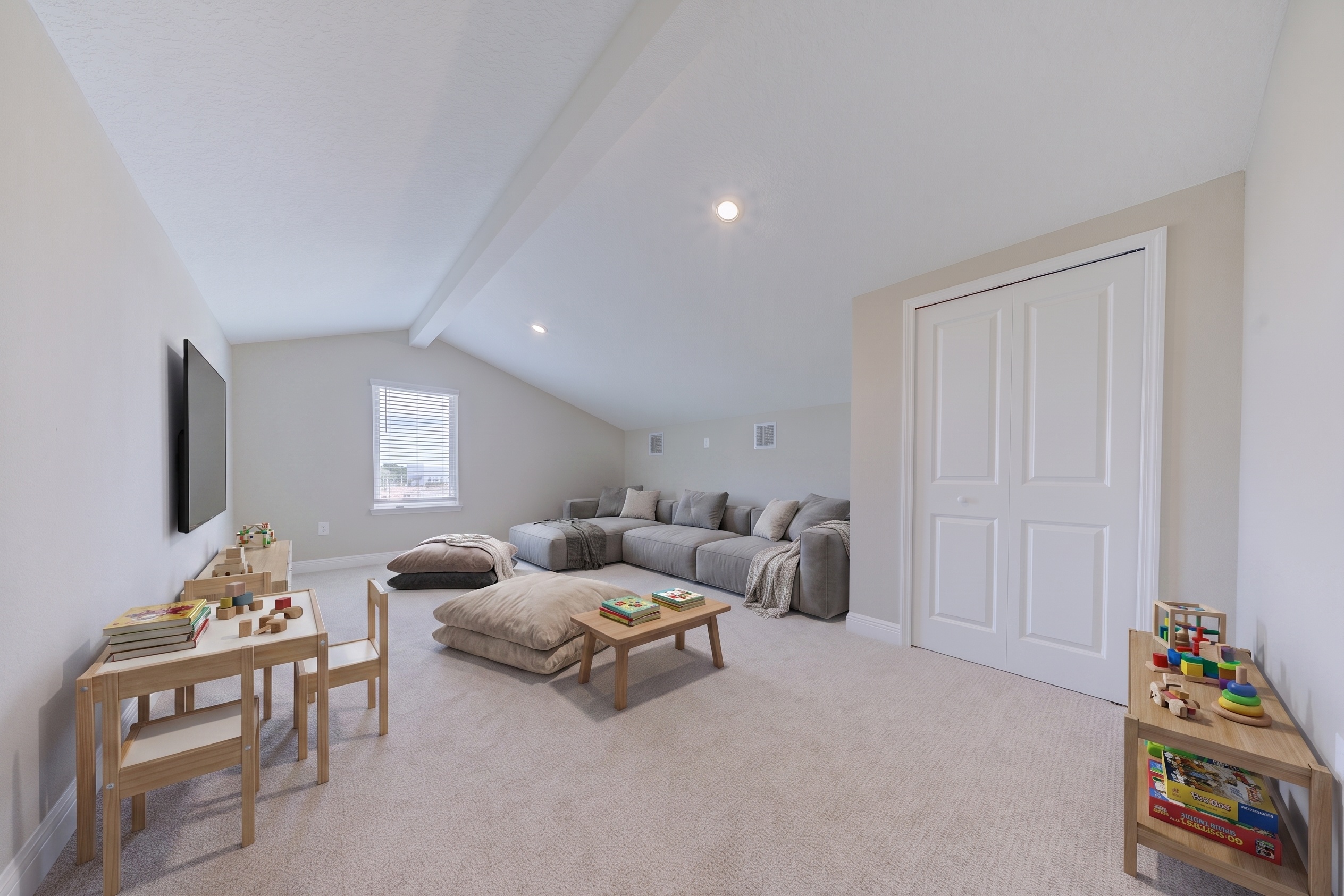 Virtually staged loft as kids playroom and media room with gray sectional, TV, play tables and toys