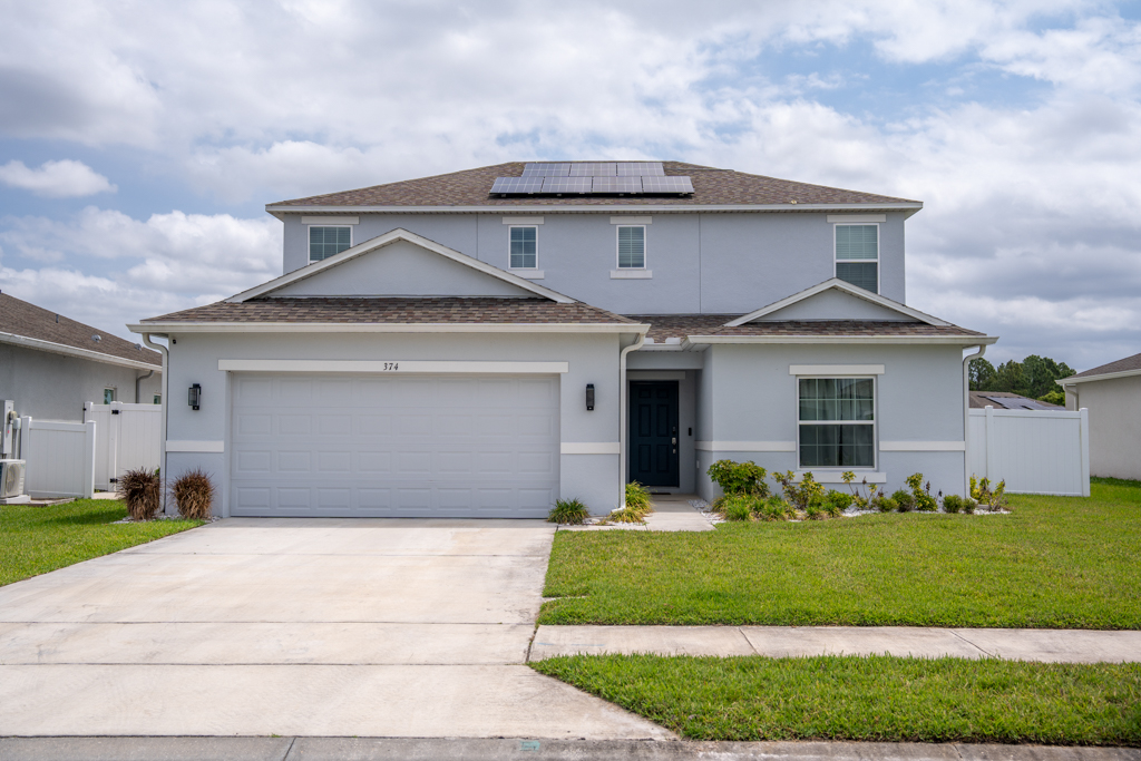Front exterior of two-story single family home in Saint Cloud, FL